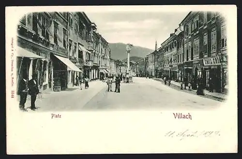 Relief-AK Villach, Geschäft von A. Tomz am Platz