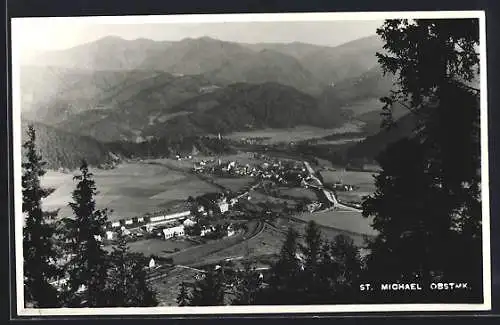 AK St. Michael /Ob.-Stmk., Ortsansicht mit Berglandschaft