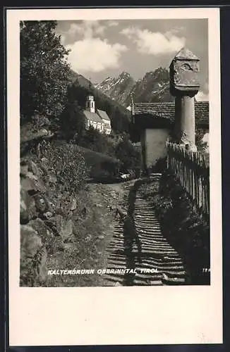 AK Kaltenbrunn /Oberinntal, Strassenpartie mit Blick zur Kirche