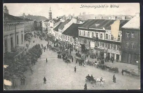 AK Wilna, Strassenpartie mit Geschäften und Passanten