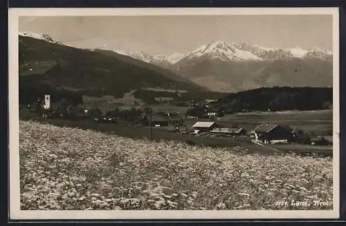 AK Lans /Tirol, Blick über eine Blumenwiese auf Ort und Gebirge