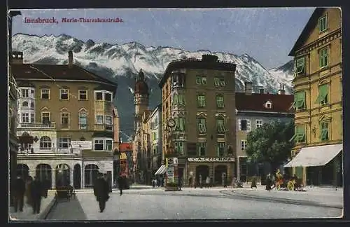 AK Innsbruck, Maria-Theresienstrasse mit Geschäft und Litfasssäule