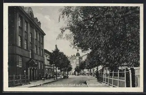 AK Güstrow i. M., Eisenbahnbrücke mit Blick auf die Strasse