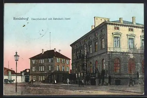 Goldfenster-AK Rendsburg, Hauptbahnhof mit Bahnhofs-Hotel mit leuchtenden Fenstern