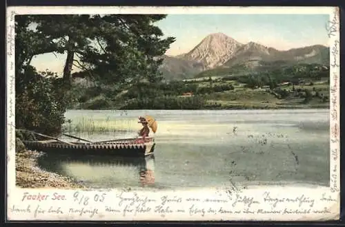 AK Faak am See, Uferpartie mit Ruderboot und Bergmassiv im Hintergrund