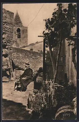 AK Les Baux, Un coin du vieux village avec une femme assise devant une église