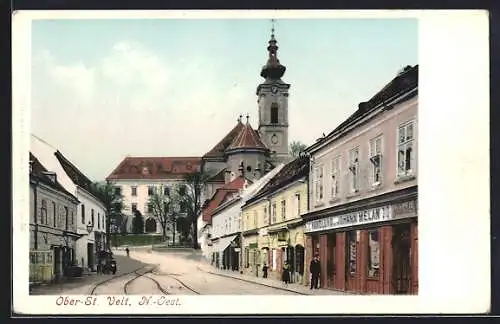 AK Ober-St. Veit, Strassenpartie mit Handlung Johann Melan und Kirche