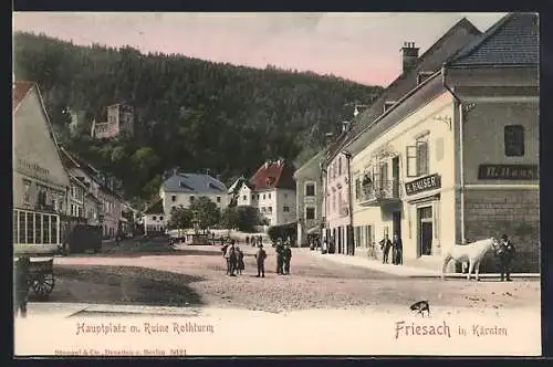 AK Friesach, Hauptplatz mit Ruine Rothturm, Geschäft H. Haus, Mann mit Schimmel