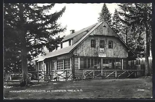 AK Herrgottschnitzerhütte am Kampstein, Ansicht zwischen Nadelbäumen