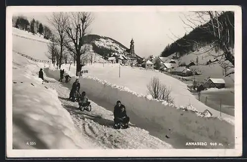 AK Annaberg, Ortsansicht im Winter mit Schlittenbahn