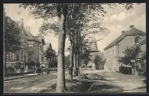 AK Aurich / Ostfriesland, Partie an der Georgstrasse, Windmühle im Hintergrund