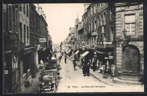 AK Vire, La Rue du Calvados animée avec voitures et passants