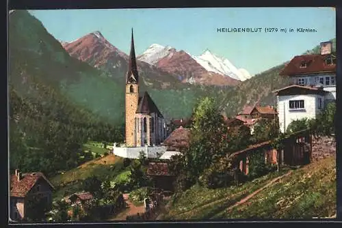 AK Heiligenblut, Teilansicht mit der Kirche und den Alpen im Hintergrund