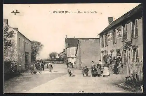 AK Avord, Rue de la Gare animée avec habitants et commerces