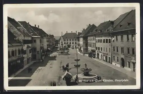 AK St. Veit a. d. Glan, Hauptplat mit Geschäften, Brunnen und Denkmal