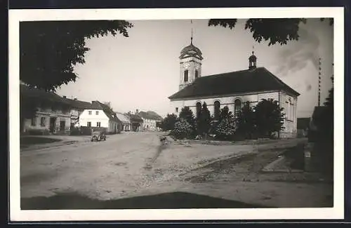 AK Knezmost, Strassenpartie mit Kirche