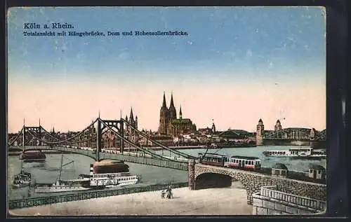 AK Köln /Rh., Totalansicht mit Hängebrücke, Dom und Hohenzollernbrücke, Strassenbahn