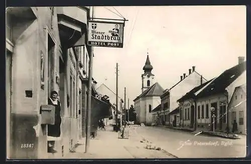 AK Gross Petersdorf /Bgld., Strassenpartie mit Hotel Post und Kirche