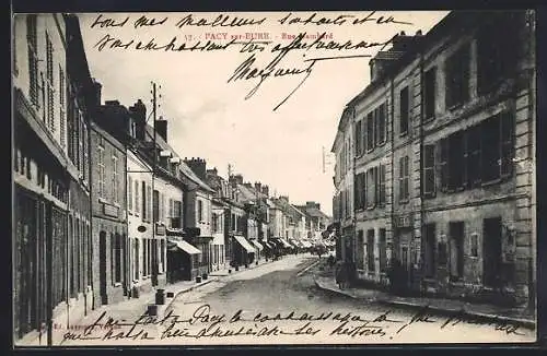 AK Pacy-sur-Eure, Rue de Paris animée avec boutiques et passants