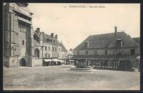 AK Nonancourt, Place des Halles avec bâtiments historiques et fontaine centrale