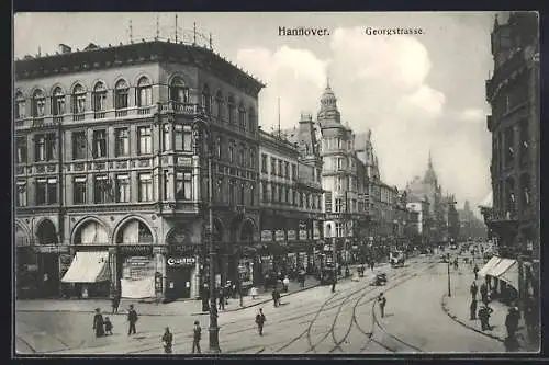 AK Hannover, Georgenstrasse mit Geschäften und Strassenbahn