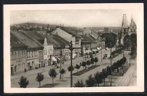 AK Rakovník, Strassenpartie mit Kirche