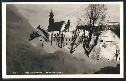 AK Annaberg, Ortspartie mit Kirche im Schnee