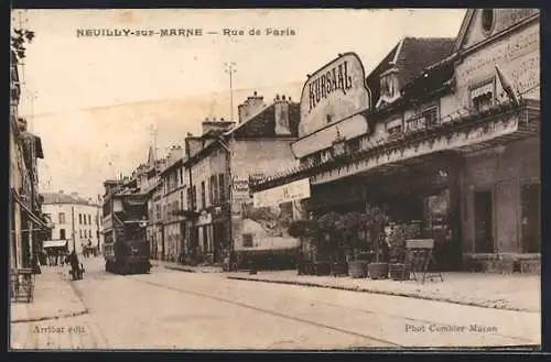 AK Neuilly-sur-Marne, Rue de Paris avec tramway et facade du Kursaal