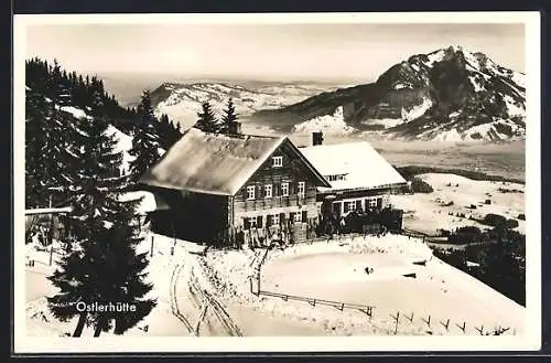 AK Ostlerhütte, Berghütte mit Panorama im Schnee