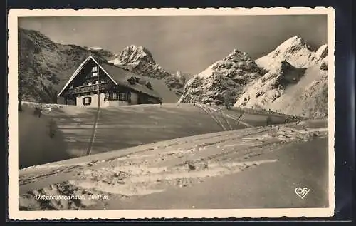 AK Ostpreussenhaus, Berghütte mit Panorama im Schnee