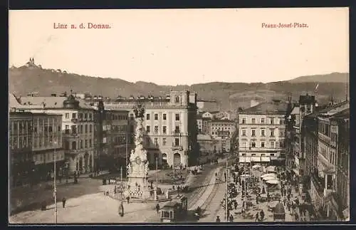 AK Linz a. d. Donau, Franz-Josef-Platz mit Denkmal und Strassenbahn