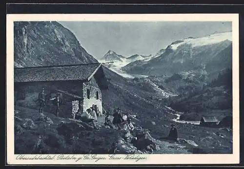 AK Kürsinger Hütte mit Obersulzbachtal Postalm, Leute rasten vor der Berghütte