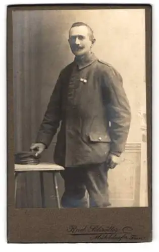 Fotografie Rud. Schrötter, Mühldorf am Inn, betagter Soldat in Uniform