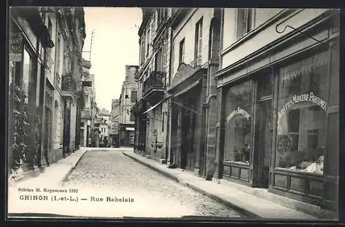 AK Chinon, Rue Rabelais animée avec boutiques et architecture historique