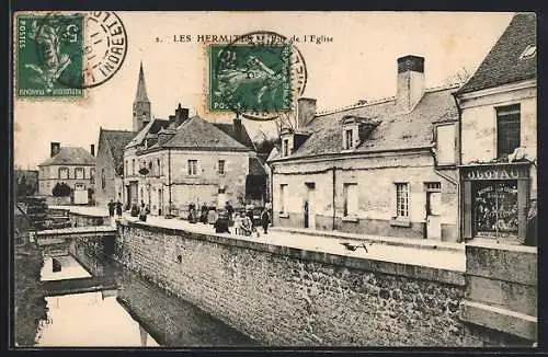 AK Les Hermites, Vue de l`église et des maisons le long du canal