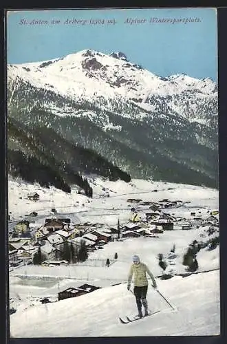 AK St. Anton am Arlberg, Skiläufer vor dem verschneiten Ort