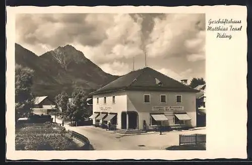 AK Piding, Geschäftshaus Matthias Traxl mit Bergen im Hintergrund