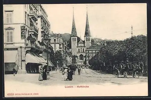 AK Luzern, Hofkirche mit Konfektionsgeschäft und Strassenbahn