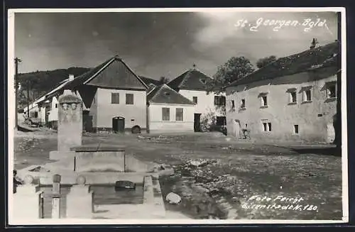 AK St. Georgen /Bgld., Strassenpartie mit Brunnen