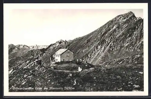 AK Sudetendeutsche Hütte am Muntanitz, Ansicht gegen die Berge