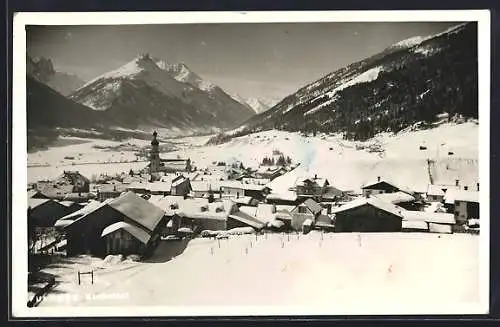 AK Fulpmes im Stubaital, Gesamtansicht mit dem verschneiten Ort