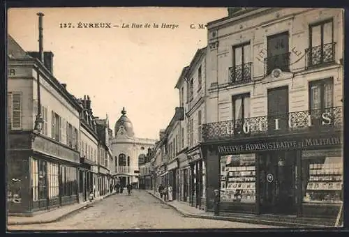 AK Évreux, La Rue de la Harpe avec papeterie et bâtiments historiques