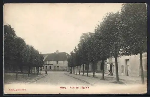 AK Mitry, Rue de l`Église avec allée d`arbres et bâtiments résidentiels