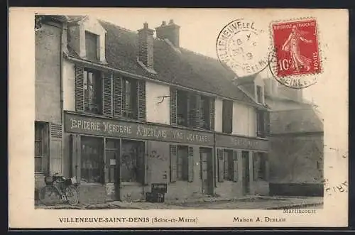 AK Villeneuve-Saint-Denis, Épicerie et mercerie A. Deblais avec vélo devant la boutique