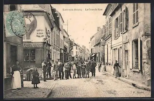 AK Lizy-sur-Ourcq, La Grande Rue animée avec passants et boutiques