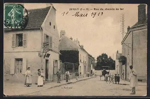 AK Juilly, Rue du chemin de fer avec passants et calèche