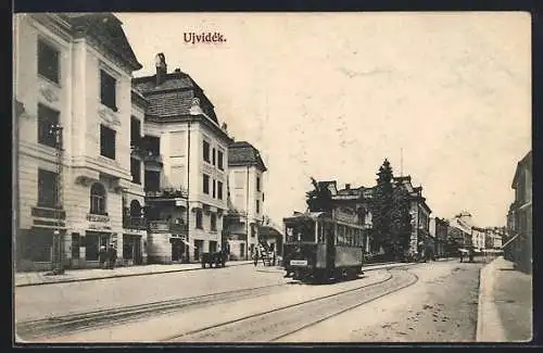 AK Ujvidék, Strassenpartie im Ortskern mit Strassenbahn