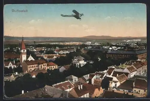 AK Wr.-Neustadt, Flugzeug über der Stadt