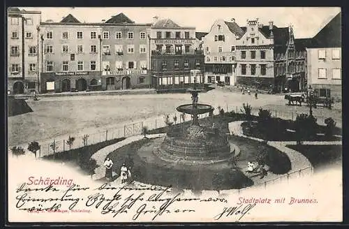 AK Schärding, Stadtplatz mit Geschäften und Brunnen
