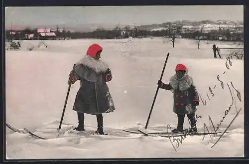 AK Skiläuferin und Kind auf Skiern